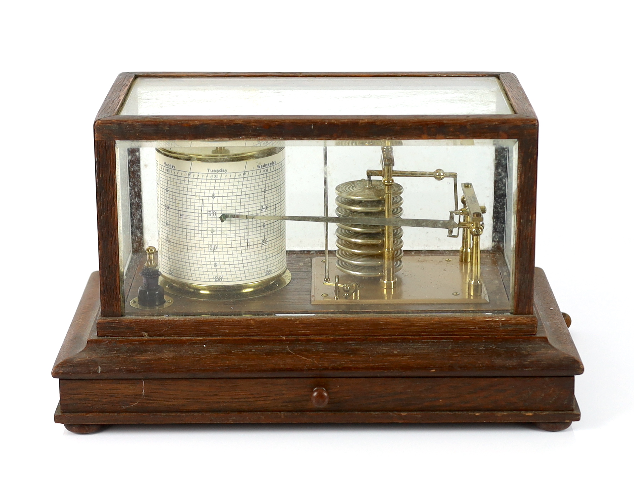 A barograph by Dollond in an oak case with bevelled glass panels and incorporating an ink bottle and a drawer with spare graph papers, 36.5cm x 21.5cm
